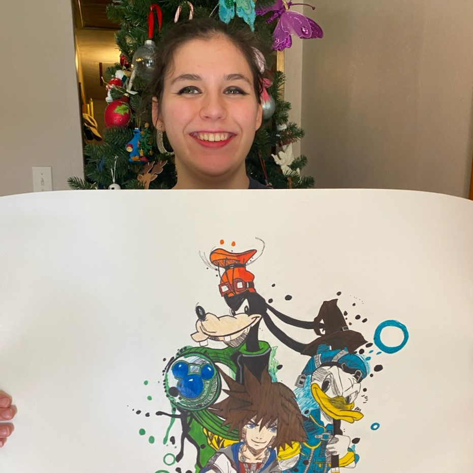 Hannah Durel proudly holds her illustration featuring Donald Duck, Goofy, and an anime character.